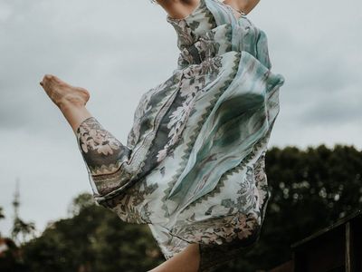 A person performing a graceful, flowing movement.